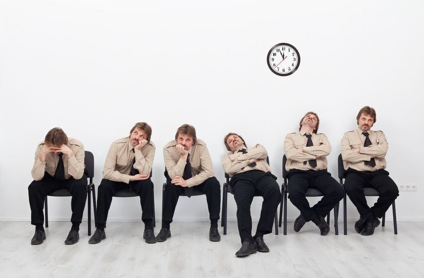 bored, stressed and exhausted people sitting on chairs waiting